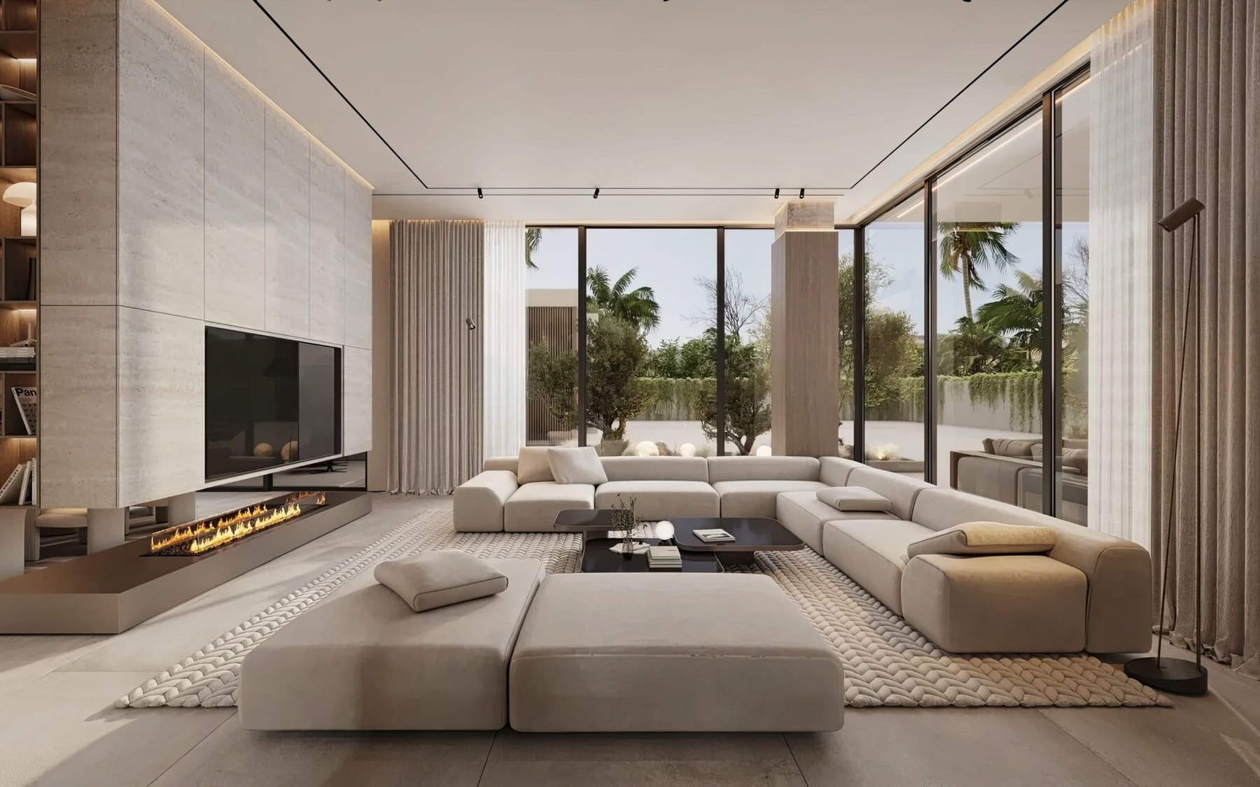 A modern living room with floor to ceiling glass and palm trees